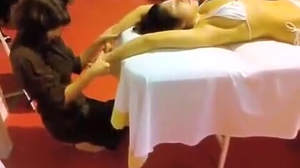 Double massage in public of an Asian bikini girl